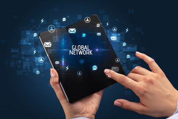 Businessman holding a foldable smartphone, social media concept