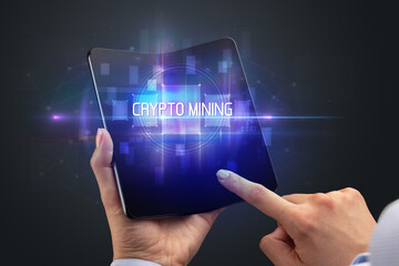 Businessman holding a foldable smartphone