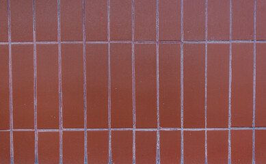 Background of brown ceramic tiles. Full frame image of brown ceramic tile wall background