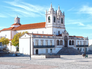 Fototapeta na wymiar City church of Nazare named Nossa Senhora at the Atlantic ocean coast of Portugal