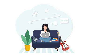 the girl is sitting at the laptop