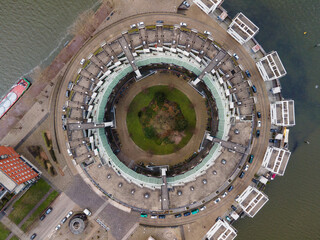 A circle shaped building resident housing aerial drone view.