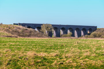 A view from the village of Helmdon toward the abandoned Helmdon viaduct on a bright Spring day