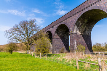 A close up view along the side of the abandoned Helmdon viaduct on a bright Spring day