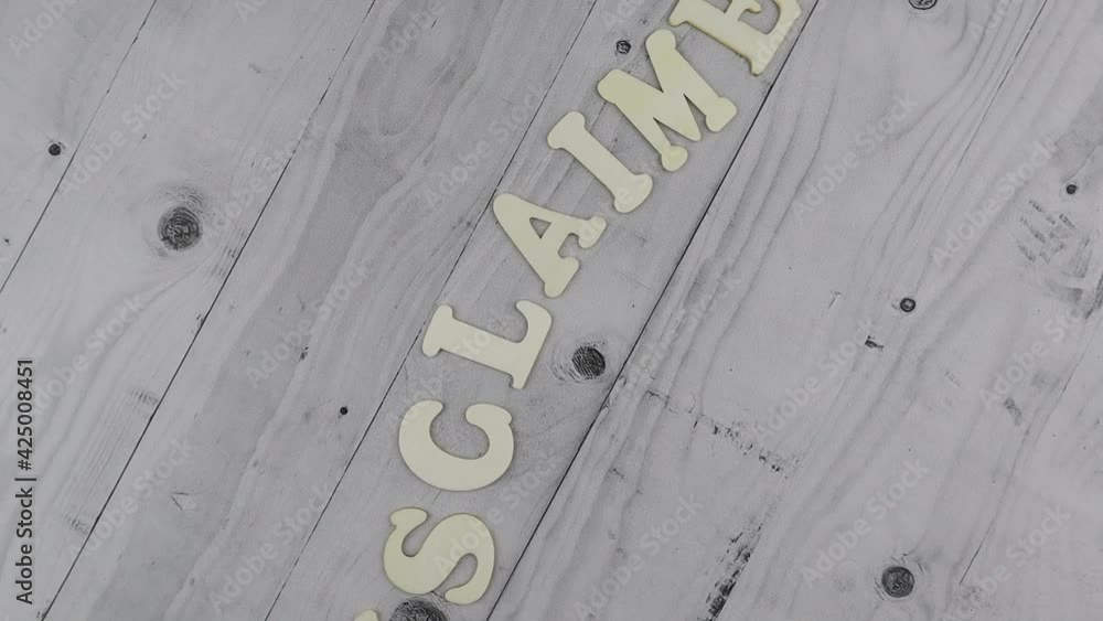 Poster disclaimer concept with undulating word in alphabet letters arranged diagonally on light grey planks
