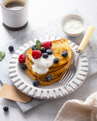 French toast or Spanish torrijas on light grey background