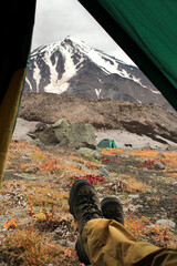 Trekking around volcanoes of Kamchatka in fall season. Northern pristine nature.