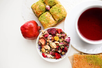 pomegranate tea in a teacup and oriental sweets