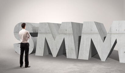 Rear view of a businessman standing in front abbreviation