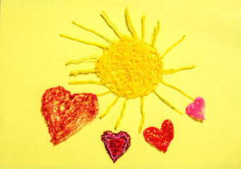 yellow sun and four pink hearts made by a three d pen on a yellow background.