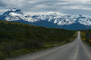 road to the mountains of Torres Del Paine with stormy sky and clouds 