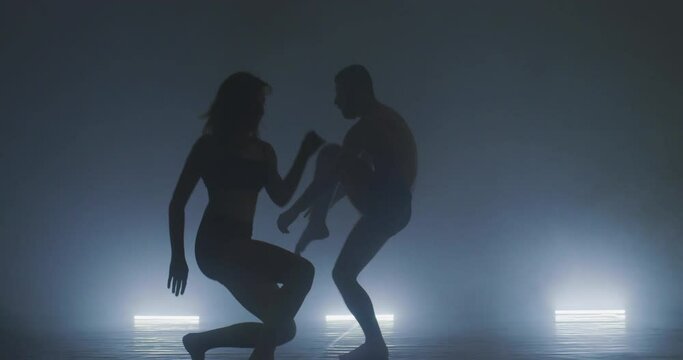 Silhouette of group dancers of contemporary ballet, ow key