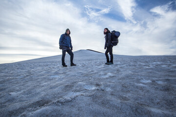 A couple in the snow on the Landmannalaugar trek, Iceland