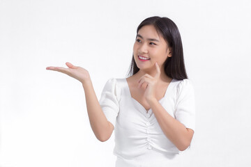 Asian beautiful woman with black long hair wearing a white shirt and pretty smiling is present product on white background.