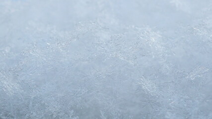 Real structural shiny snowflakes close-up.