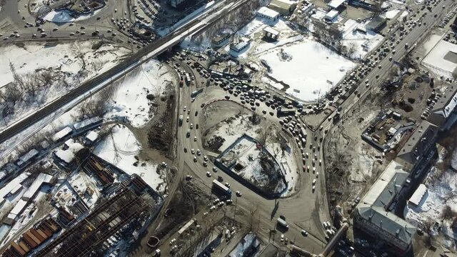 a large transport ring frozen in a traffic jam, filmed from a height on a drone 