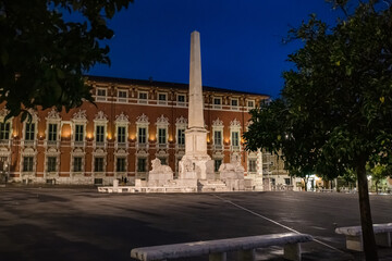 Cityscape. View of Piazza Aranci in Massa with the commemorative monument in the center and on the...