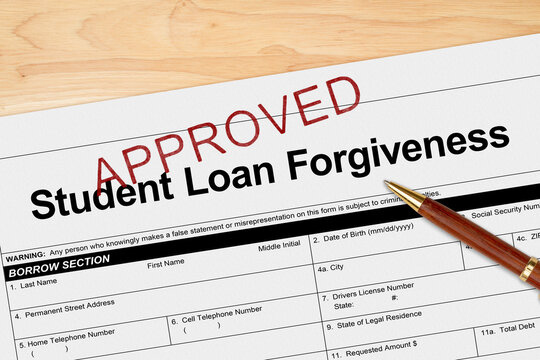 Student Loan Forgiveness application approved with pen