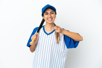 Young caucasian woman playing baseball isolated on white background surprised and pointing front