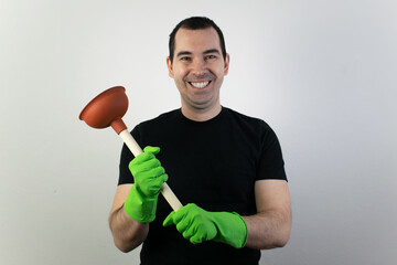 drain issues, hand hold plunger, young male stand and plumbing sewer pipe