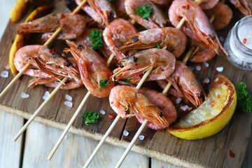 Shrimp kebab. Grilled shrimp on sticks. Fried shrimps in shells. Mediterranean Kitchen.