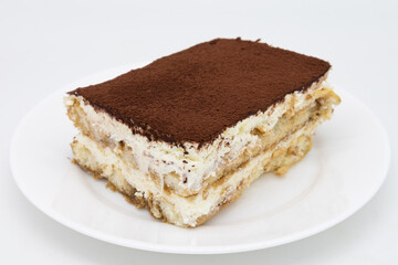 Delicious Large Slice of Homemade Tiramisu on a White Plate