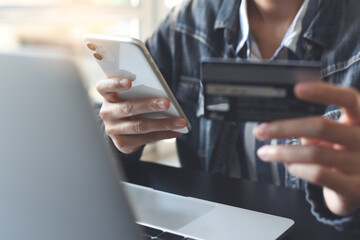 Online Shopping on Laptop and mobile banking, internet payment using credit card via mobile phone, digital marketing, E-commerce concept