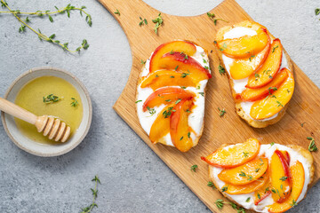 Homemade summer toast with cream cheese, honey and peaches.