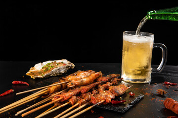 Shashlik. Kebab. Grilled barbecue meat with beer