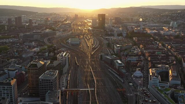above, aerial, aerial view, architecture, blue, bridge, building, business, center, church, cinematic, city, cityscape, culture, downtown, drone, drone stock footage, europe, famous, flying, fraumunst