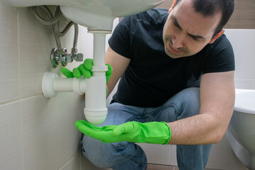 Drain Problems, blockage male floor tired sink pipe bathroom repair draining