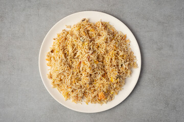Biryani rice dish on gray stone background. view from top