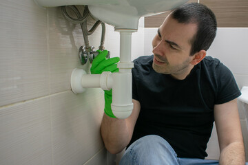 Drain Problems, blockage male floor tired sink pipe bathroom repair draining