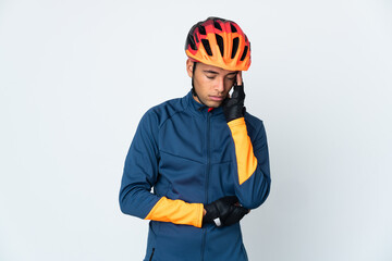 Young cyclist Brazilian man isolated on white background with headache - obrazy, fototapety, plakaty