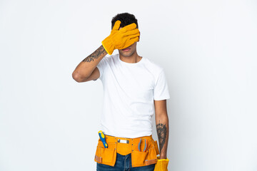 Young Brazilian electrician manipulated isolated on white background covering eyes by hands. Do not want to see something