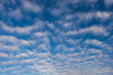 Bizarre white clouds in blue sky