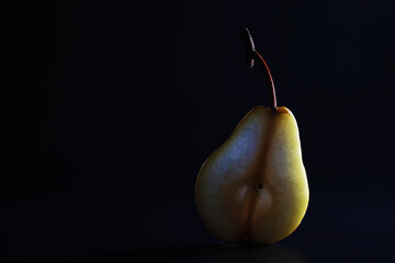 Pear slices on a black background.