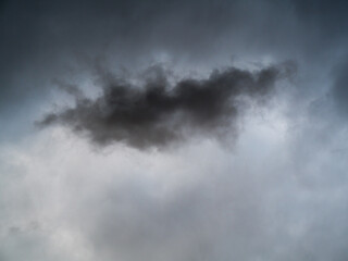 Fototapeta na wymiar Dramatic sky with dark cloud in middle 