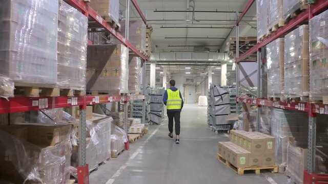 Guy loader goes through the warehouse