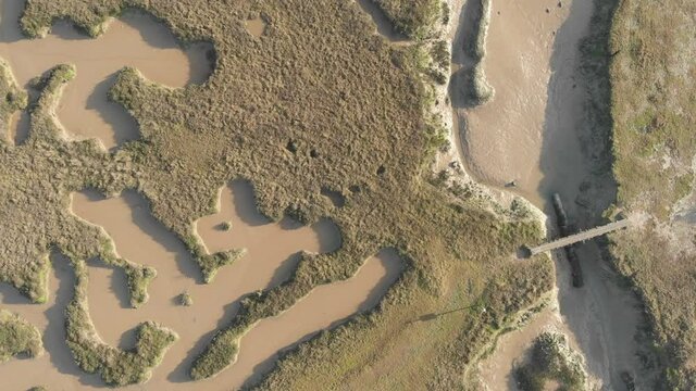 Top down view flying sideways over Tollesbury marshes