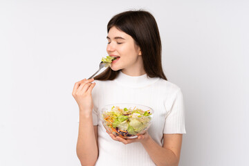 Young Ukrainian teenager girl holding a salad over isolated white background