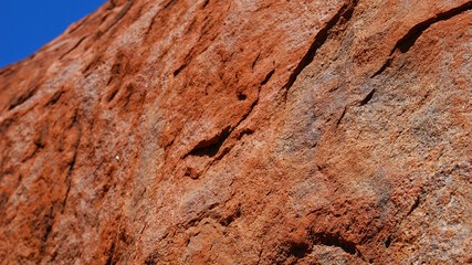 close up of a red stone in the sunlight