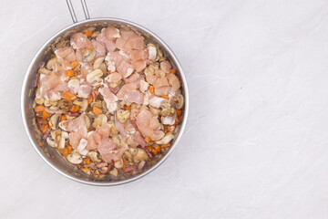 Cooking mushrooms with onions carrots and bacon