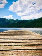 Fototapeta na wymiar wooden bridge over lake