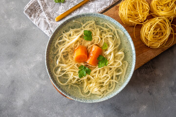 Turkey and beef broth with noodles in a bowl