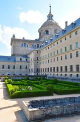Fototapeta na wymiar El Escorial, Spain - June 2019: El Escorial Palace and gardens outside Madrid