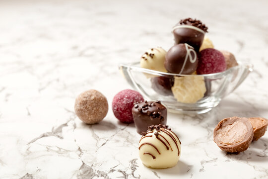 Chocolates candies on the table. Close-up. Postcard. Place for your text. High quality photo