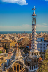 Park Guell with panoramic view onto the skyline of Barcelona with fluffy clouds