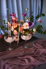 flower decoration of wedding venue and ceremony, details. smoked alcohol cocktail with dry ice and burning candles on table