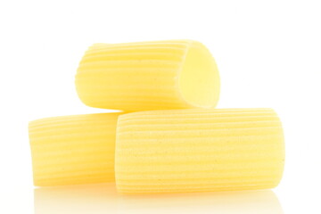 Bright yellow uncooked pasta, close-up, isolated on white.